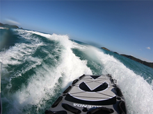 Load image into Gallery viewer, Agenda Surf Co PWC Jet Ski Rescue Sled in Action Behind a Jet Ski
